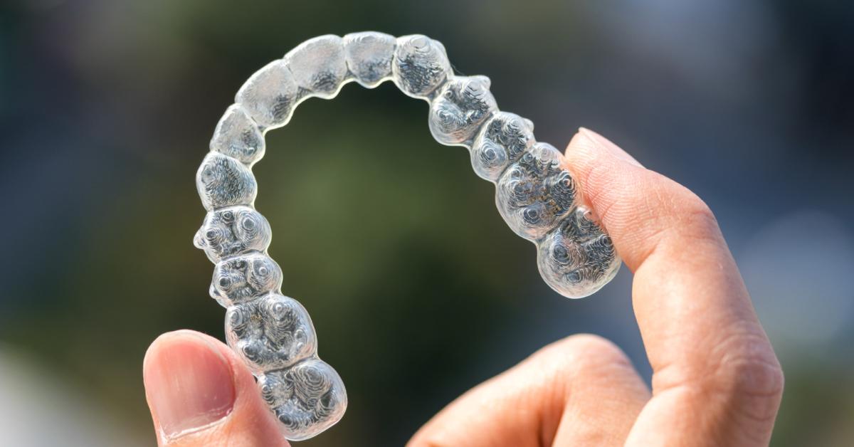 Holding Invisalign braces
