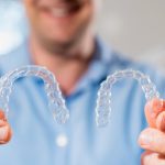 Dentist with Invisalign braces